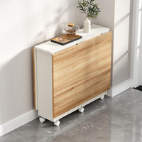 Ensemble de table à manger moderne compact et multifonctionnel avec pieds en fer et chaises en bois sur roulettes, design pliable et gain de place