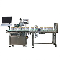 Machine de marquage laser de précision pour marquer le dessus et le dessous des boîtes de lait en poudre, permettant une fonction de traçabilité complète et individuelle des produits en temps réel