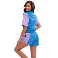 Ensemble de survêtement rétro 80s pour femme, 2 pièces, style disco, avec haut à col revers et manches courtes zippé, et short, idéal pour les fêtes et les spectacles de carnaval.