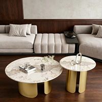 Table basse en dalle de roche ronde avec structure en acier inoxydable, mobilier moderne et minimaliste pour salon