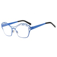 Lunettes anti-lumière bleue colorées à double couleur uniques avec monture métallique creuse et décoration optique œil de chat papillon