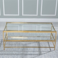 Table basse de luxe à deux niveaux en verre trempé avec cadre en acier inoxydable doré pour hall d'hôtel