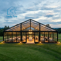 Tente de réception de luxe en aluminium noir avec toit transparent et parois en verre trempé pour mariage, banquet et gala en extérieur
