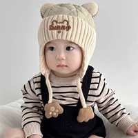 Bonnet tricoté mignon avec cache-oreilles pour bébés de 0 à 2 ans, vente en gros d'usine, chapeau chaud à enfiler pour garçons et filles, collection automne-hiver