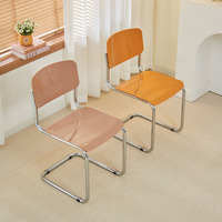 Chaise flottante minimaliste nordique Design créatif en métal pour salle à manger et salon pour bureau loisirs inspiré tabouret de magasin de thé au lait