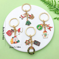 Porte-clés en alliage tendance transfrontalier, cadeau de Noël festif, avec Père Noël et flocon de neige de dessin animé, breloque pour AirPods et pendentif accessoire de sac