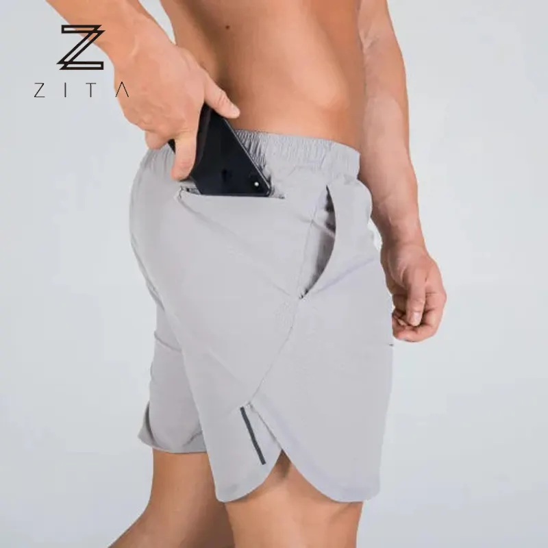 Pantalones cortos de entrenamiento de gimnasio para hombre, 2 en 1, con bolsillo y cremallera, transpirables, con logotipo personalizado