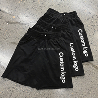 Shorts en molleton de coton noir à ourlet brut, coupe ample, avec logo brodé personnalisé OEM ODM, taille élastique, pour hommes