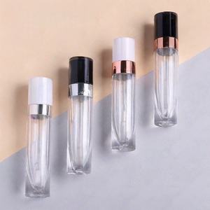 Tubo de brillo labial negro personalizado al por mayor de 6 ml, tubo de lápiz labial vacío, botella redonda blanca para rellenar bálsamo/aceite al por mayor - Product Image 4
