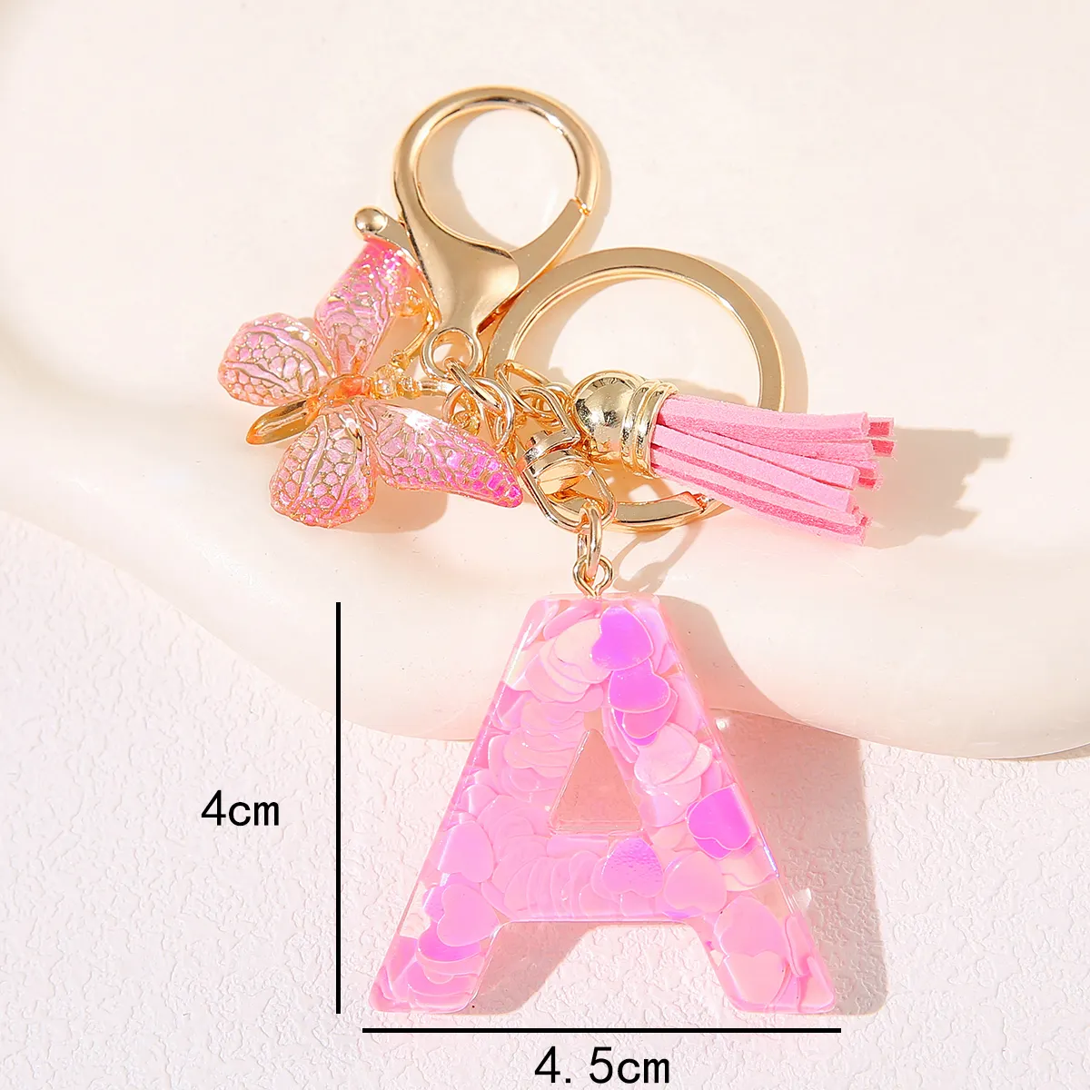 Factory wholesale high quality new pink butterfly drops glue Big Heart sequin letter pendant ladies key chain