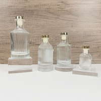 Diffuseur de parfum d'ambiance de luxe 100ml 200ml en verre transparent sérigraphié avec bouchons en verre doré personnalisables