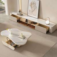 Table basse OEM en marbre véritable de style crème français, avec plateau surélevé, porte coulissante cannelée et étagère ouverte, personnalisable pour salon