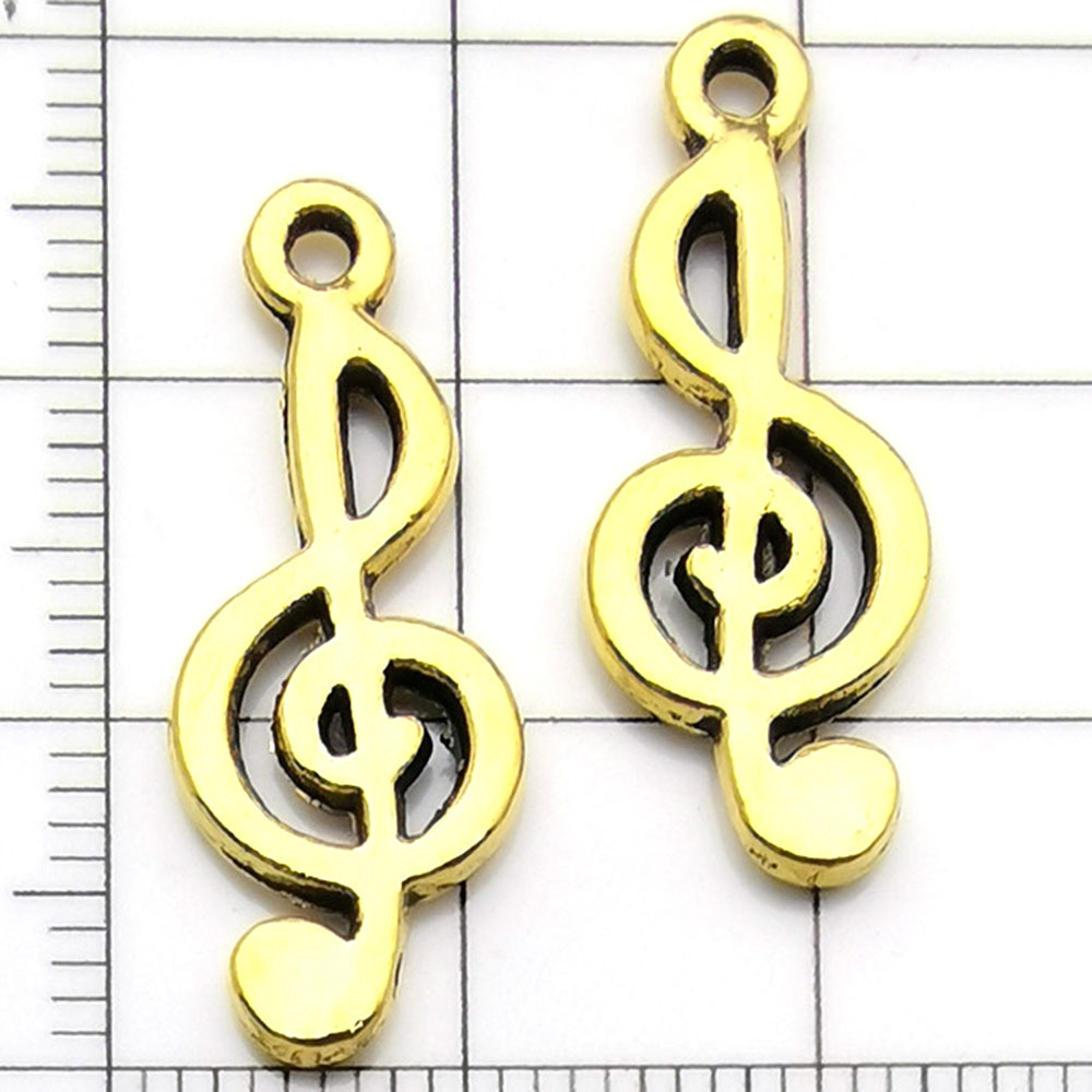 Une note de musique ancienne en or - 1,3g - 25*10mm - 11119