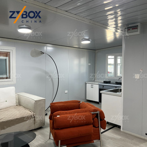 <span class=keywords><strong>Casa</strong></span> Contenedor Expandible de 40 pies con Techo a Dos Aguas Azul Rey, Silla Columpio Blanca para Porche, Cabaña Modular Prefabricada para Bosque - Product Image 2