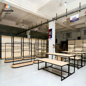 Modern Stainless Steel Clothing <b>Display</b> Racks | <b>Wall</b>-Mounted & Island Garment <b>Cabinets</b> | Custom Boutique Retail Fixtures - Product Image 1