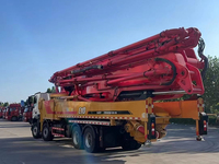 Camion pompe à béton San-y C10 d'occasion, flèche de 62 m, châssis spécial Sany, 348 kW, 54 tonnes, pour le coulage de béton dans les bâtiments de grande hauteur