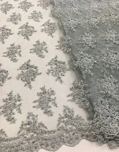La migliore vendita grigio in rilievo del merletto di tulle tessuto metallico del ricamo disegni di pizzo tessuto del vestito da sera per il partito