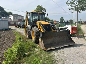 รถตักล้อยาง JCB รุ่น 4CX สีเหลือง มือสอง สำหรับงานก่อสร้าง พร้อมหัวตักด้านหน้าและแขนขุด น้ำหนักเครื่องยนต์ 7000 กก. ใช้งานมาแล้ว 0-2000 ชั่วโมง - Product Image 3