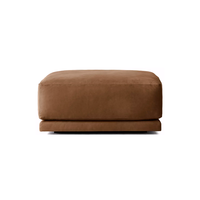 Canapé d'angle en cuir au design tendance en forme de L, avec accoudoirs larges et coussins moelleux pour salon