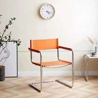 Fauteuil minimaliste de style nordique, chaise incurvée en tube d'acier inoxydable, chaise de salle à manger en similicuir
