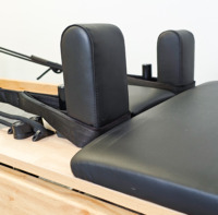 Reformer de Pilates pliable en chêne certifié CE, entièrement personnalisable, machine d'entraînement en bois pour studio de Pilates et usage commercial