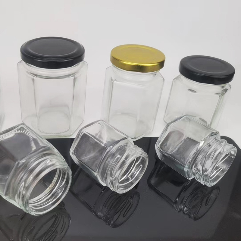 In Stock 45ml 60ml 85ml 100ml 180ml 280ml 380ml 580ml 730ml Hexagonal Shape Glass Storage Canister Jars for Jam Honey