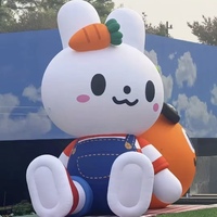 Modèle de lapin gonflable personnalisé mignon, mascotte gonflable en tissu Oxford avec carotte pour la décoration des centres commerciaux