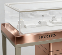 Comptoir de présentation de bijoux LED en or rose de luxe avec dimensions personnalisables, vitrine en verre durable pour les bijouteries et les centres commerciaux