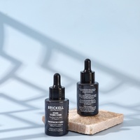 Özel logo ve renkli 1oz 30ml düz omuzlu cam damlalıklı şişe cilt bakımı esansiyel yağ şeffaf kozmetik kabı kutulu