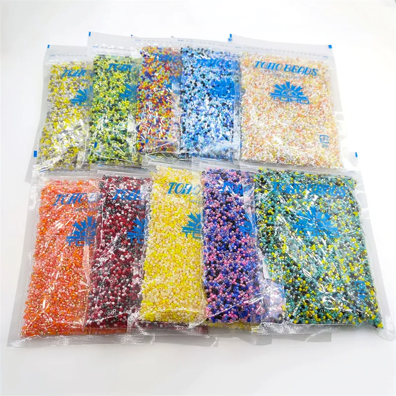 Venta al por mayor 100 g/bolsa de calidad superior TOHO japonés cuentas de colores mezclados 11/0 mini granos de la semilla de cristal para la fabricación de la joyería