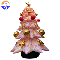 Sapin de Noël gonflable géant personnalisé avec base en tronc d'arbre, décoration de Noël pour les fêtes en plein air, les centres commerciaux, les cours et les festivals