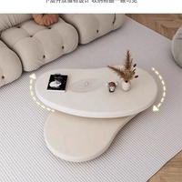 Table basse rotative sculpturale en forme de nuage, crème mat, à deux niveaux, panneaux superposés, courbes organiques, pour salon