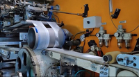 Machine de fabrication de produits pour bébés, machine de fabrication de couches pour bébés/couches jetables automatiques