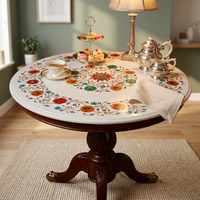 Table basse ronde moderne en marbre blanc avec incrustations florales, pièce maîtresse pour le salon