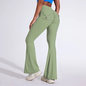 Pantalones de yoga acampanados sin costuras con cintura elástica alta, bolsillos traseros y efecto realce de glúteos, de color liso, en Spandex/Nylon - Product Image 4