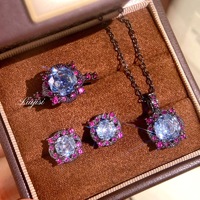 Ensemble de bijoux fantaisie pour femme : Collier pendentif bleu marine à huit points taillés en forme de rose, boucles d'oreilles rondes en cuivre plaqué or noir et bague ouverte - Vente en gros