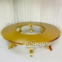 Table de salle à manger de luxe moderne en acier inoxydable avec plateau en verre trempé, design serpentin en S doré, pour hôtels et événements extérieurs, durable