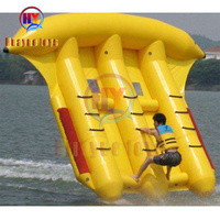 Jeu de sport fou PVC bateau banane gonflable pontons de mer en gros installations d'amusement aquatique