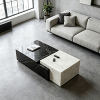 Table basse moderne en marbre noir et blanc imbriquée. Meubles en pierre géométriques de luxe pour la décoration du salon.