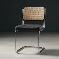 Chaise de salle à manger confortable de style mid-century moderne en fer et rotin avec coussin en cuir pour hôtel et appartement