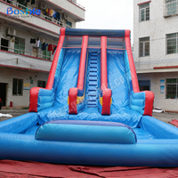 Toboggan aquatique gonflable commercial robuste à double piste avec grande piscine pour location en parc aquatique ou complexe hôtelier