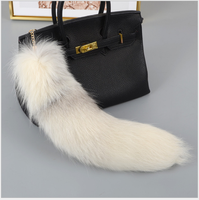 Véritable prix de gros de luxe Porte-clés en fourrure de queue de renard Porte-clés en fourrure de queue de renard véritable Pendentif de sac d'approvisionnement d'usine en gros