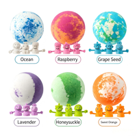Bombes de bain aux huiles essentielles multicolores en boîte et boules de sels effervescents