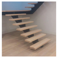 Escalier à monopoutre finition titane élégante, marches flottantes en frêne, rampe d'escalier avec éclairage intégré