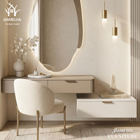 Ensemble de meuble-lavabo mural contemporain avec miroir LED de forme irrégulière et éclairage d'ambiance, coiffeuse flottante, mobilier de chambre moderne