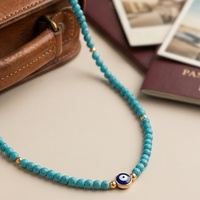 Collier de perles turquoise style bohème pour femme, avec accent doré et pierres vintage, accessoire quotidien pour dames