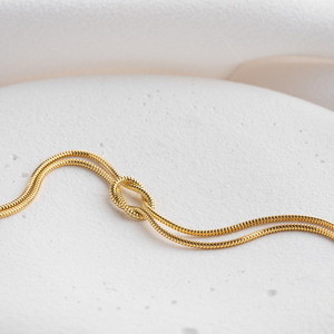 Minimalista placcato in oro 18K catena di <span class=keywords><strong>serpente</strong></span> Love Knot <span class=keywords><strong>bracciale</strong></span> donne gioielli impermeabili amicizia in acciaio inossidabile coppia braccialetti - Product Image 5