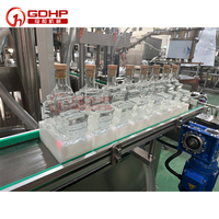 Llenado automático de líquido de vino tinto, jarabe de arce, bomba de engranajes de vino, llenado y agrietamiento de la función de sellado de corcho controlada por PLC