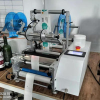 Autocollant à bas prix petite entreprise usine manuelle semi-automatique conteneur bouteille ronde étiqueteuse avec codeur de date