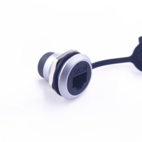 Adaptateur RJ45 rond femelle-femelle pour montage sur panneau